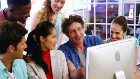 group of business executives interacting over computer