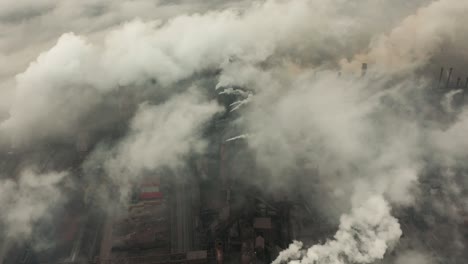 aerial view of an industrial pipe pollutes the air next to people living in the city. create a greenhouse effect