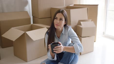 Thoughtful-young-woman-contemplating-her-new-house