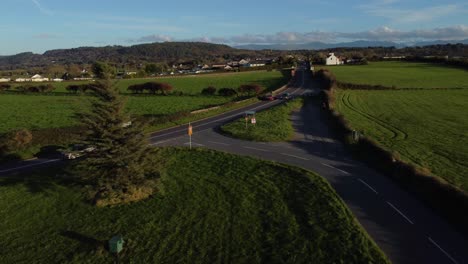 aerial view towards vehicles restriction to 20 miles per hour speed limit in rural farming countryside