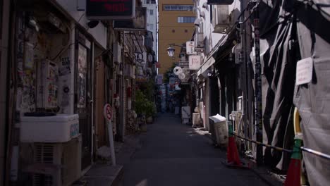 daytime charm of golden gai, shinjuku tokyothe rustic charm of golden gai’s bar-lined alleys under the soft daytime light.
