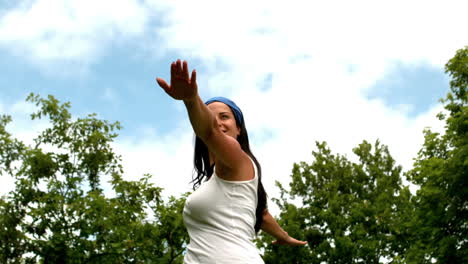 Pretty-brunette-doing-yoga-in-the-park