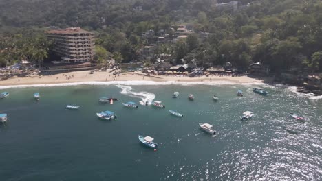 Jet-Ski-at-Mismaloya-Beach-The-Sierra-Madre-Mountains-meet-the-serene-waters-of-the-Mexican-Pacific-Ocean-at-the-beach-of-Mismaloya,-a-quaint-fishing-village-just-15-minutes-south-of-Puerto-Vallarta