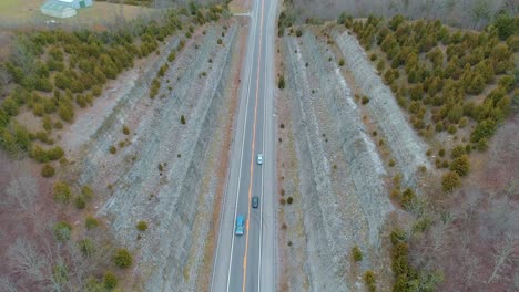 Aerial-shot-over-US-127-North-with-multiple-vehicles-traveling-up-and-down-the-roadway-beautiful-leading-lines