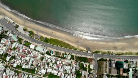 View-of-coastline-of-Da-Nang-Vietnam,-overhead-aerial-tilt-up