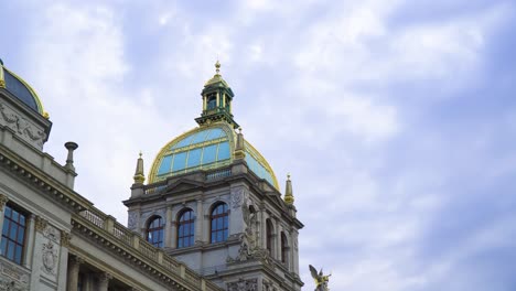 prague's mesmerizing architecture with a golden top roof tower and aqua blue colour windows iconic building in the heart of the city where most tourists go to admire this creation based on bible