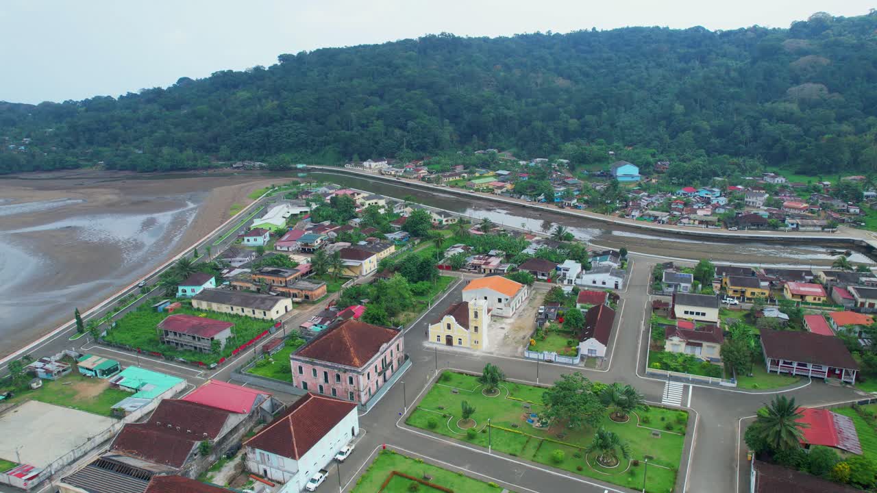 Aerial circular view over Santo Antonio city revealing the sea. Ilha do Principe (Prince Island), Africa