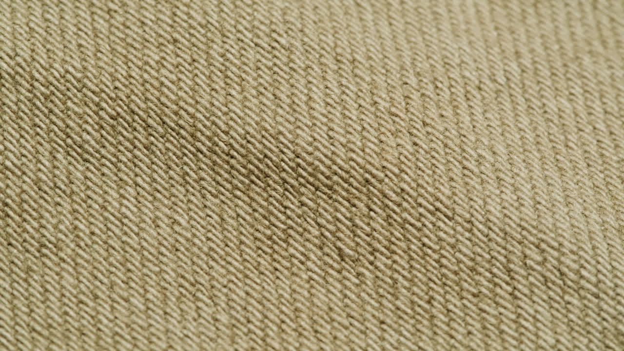 Close-up view of beige woven fabric