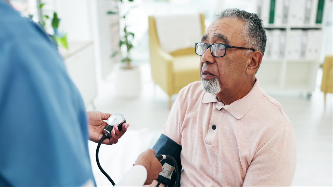 Premium stock video - Old man patient, doctor and blood pressure check