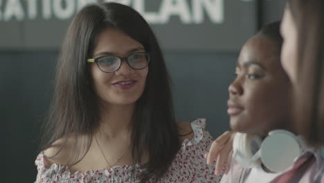 pretty student girl talking with her friends,