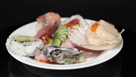 various sushi pieces displayed on a plate