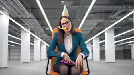 one sad woman throws colorful confetti, sitting in a chair.