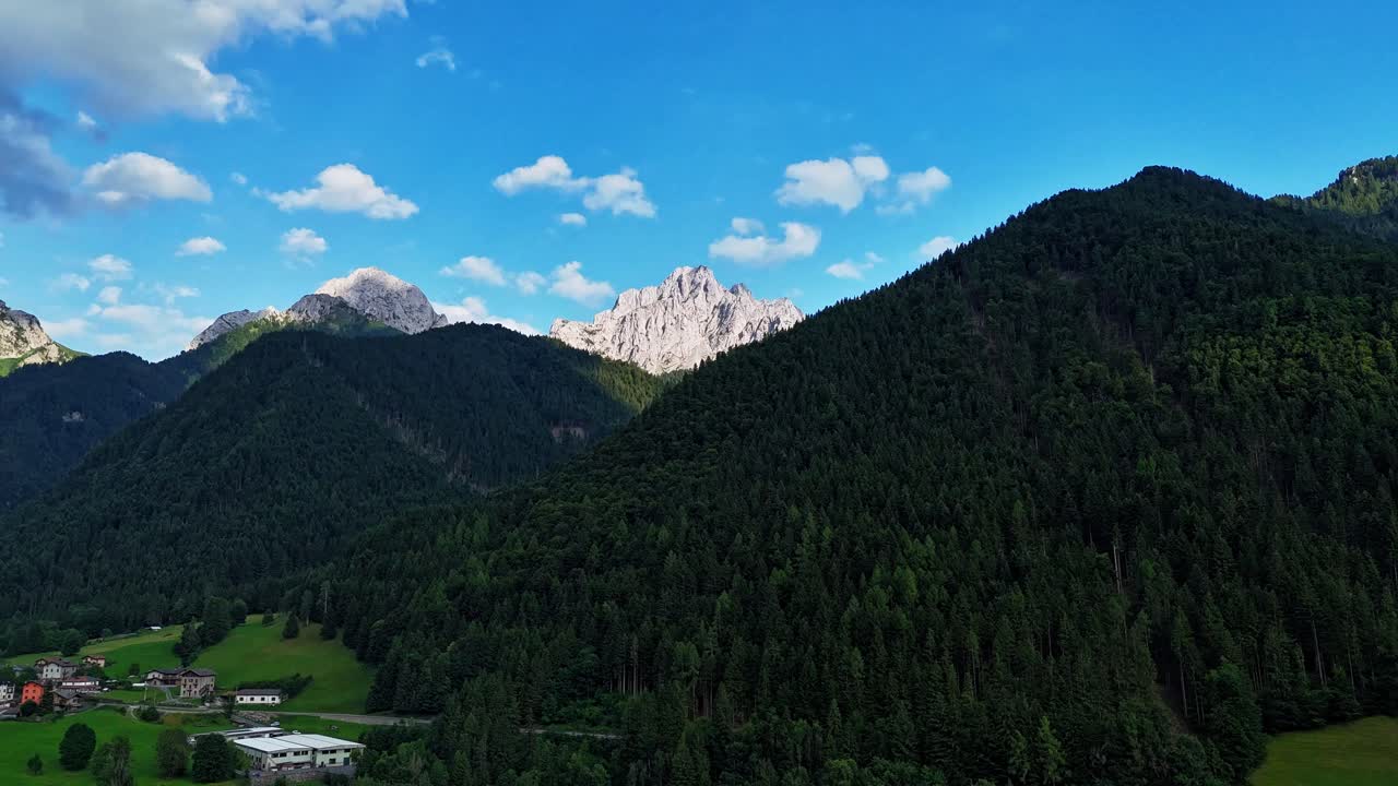 Spectacular aerial drone hyperlapse flying over the mountain valley. Majestic moving timelapse of the Orobie Alps landscape in Val di Scalve, Italy