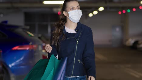 handheld video of woman coming back on shopping