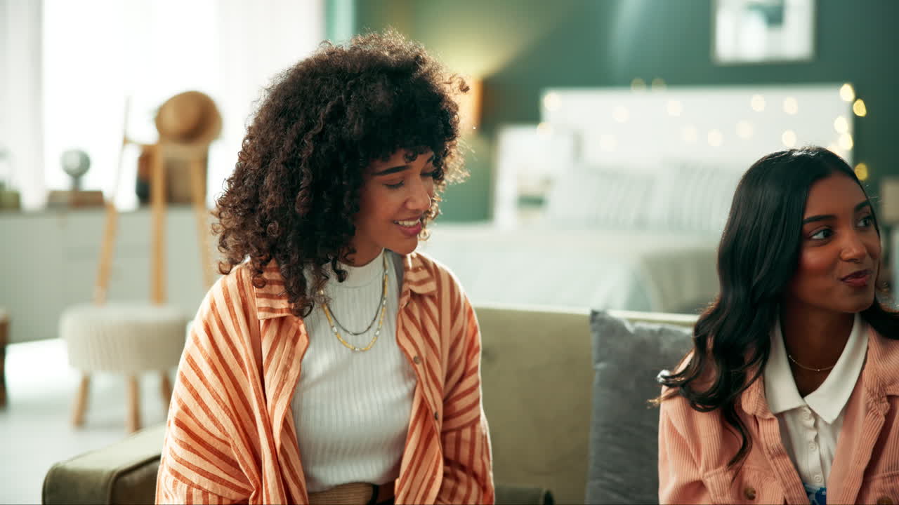 Women chatting in a bedroom
