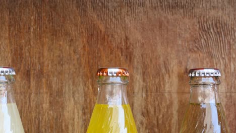 three glass soda bottles