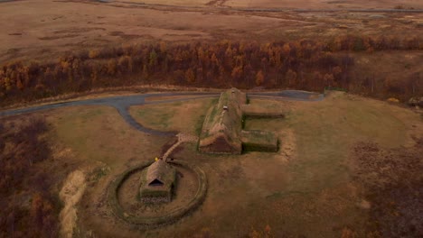 aerial 4k view of traditional icelandic turf houses in autumn with a beautiful landscape, iceland, europe, orbit shot