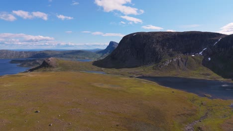 aerial view of a beautiful norwegian mountain landscape with clear skies and a serene lake