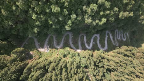 Top-Down-view-of-Kossdalssvingene-moving-up-Revealing-Beautiful-Nature-in-Osterøy,-Norway