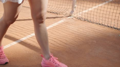 beautiful tennis girl practicing serve on outdoor court