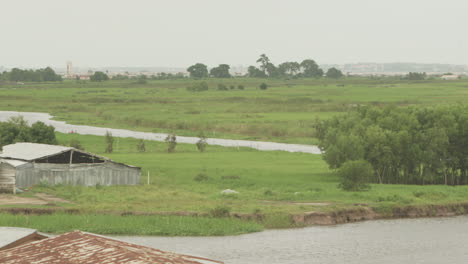 slow pan over benin landscape by lake nokoue