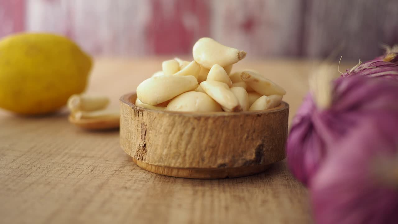 Garlic, lemon, and onion in a bowl