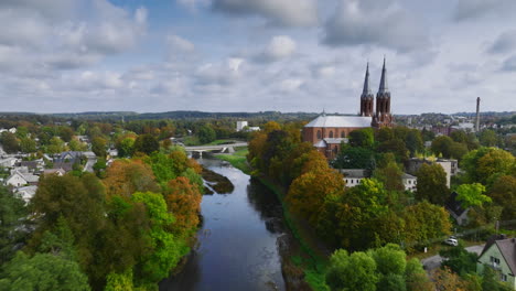 Drone-view-of-river-Sventoji-in-Anyksciai,-Lithuania,-eastern-Europe