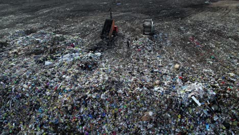 garbage dumpsite with trucks