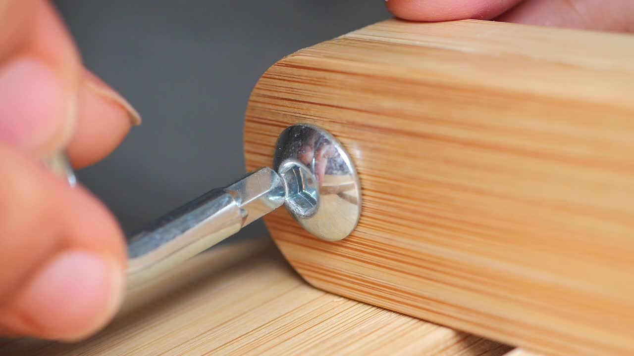 Assembling furniture with an Allen wrench and hex screws