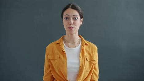 woman waving hello on video call