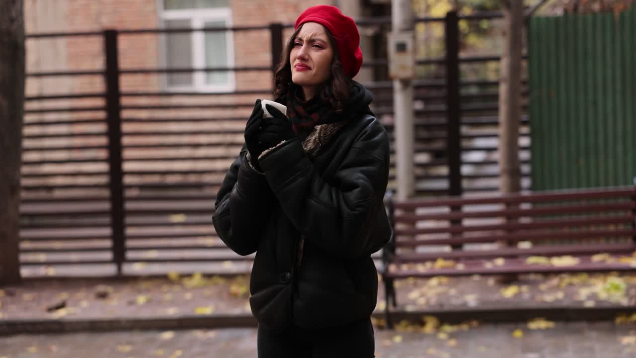 Woman in Red Beret Suffering from Cold Outdoors