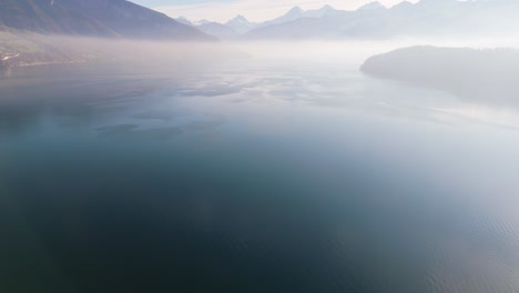 misty swiss alps lake view