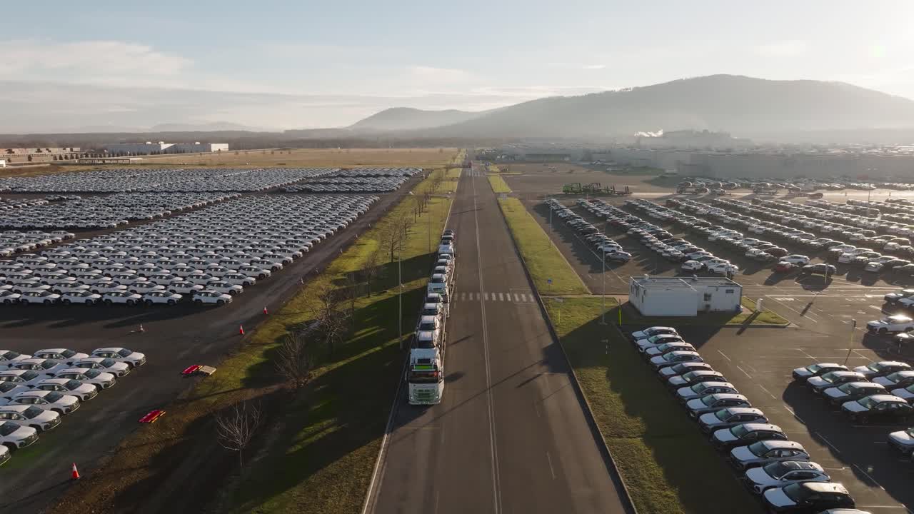 Aerial - car carrier trailers near mass vehicle storage area