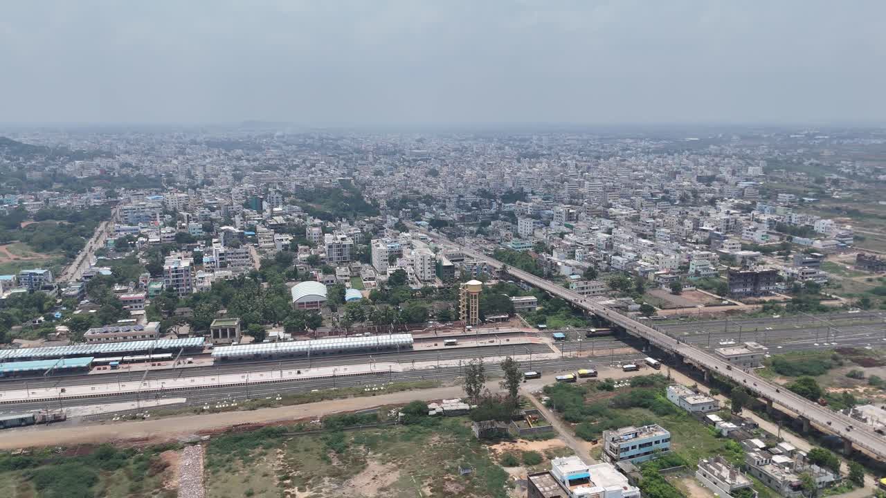 Overhead drone footage of a calm countryside road and Railyway station