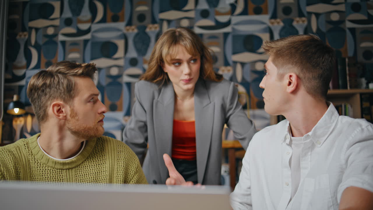 Creative managers discussing project looking monitor at conference room closeup
