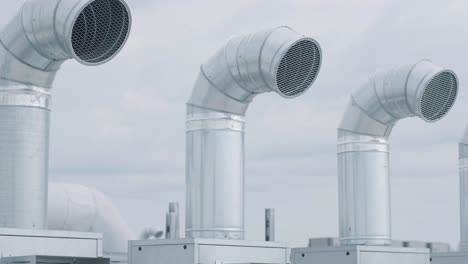 the air conditioning and ventilation system of a large industrial facility is located on the roof. it includes an air conditioner, smoke exhaust, and ventilation.