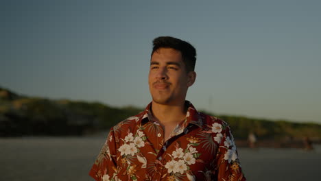 Smiling-guy-walking-on-sand