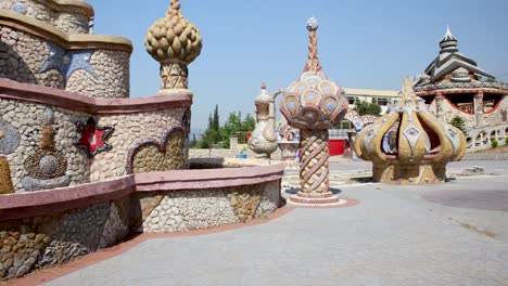 Colorful-Artistic-Castle-Structures-in-Bakhoun,-Lebanon---Panning-Shot