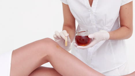 woman about to get legs waxed