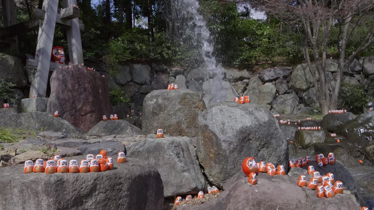 Katsuoji shrine near Osaka, Japan with waterfall in slow motion