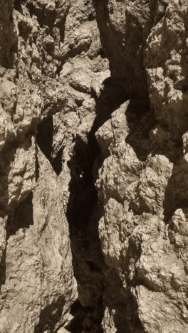 a narrow canyon with towering rock walls