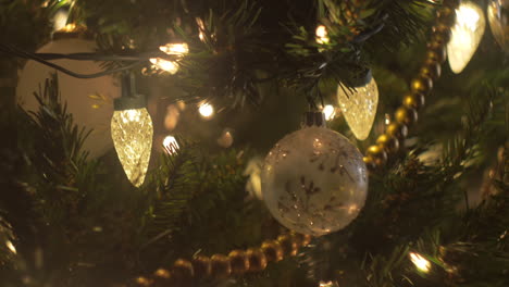 christmas tree ornaments and lights in a close up, bokeh, slider move, cute decorations