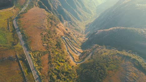 top down view of mountain rainforest road, serra do rio do rastro and the mountains of santa catarina at sunrise