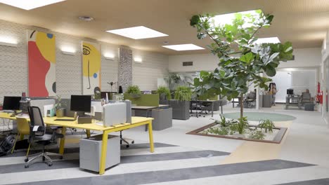 slow establishing shot of an empty office with abstract artwork hanging