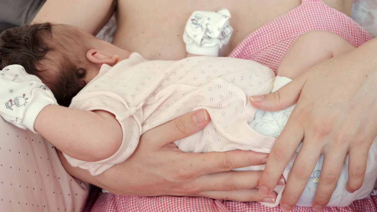 Intimate close up of a mother breastfeeding her baby
