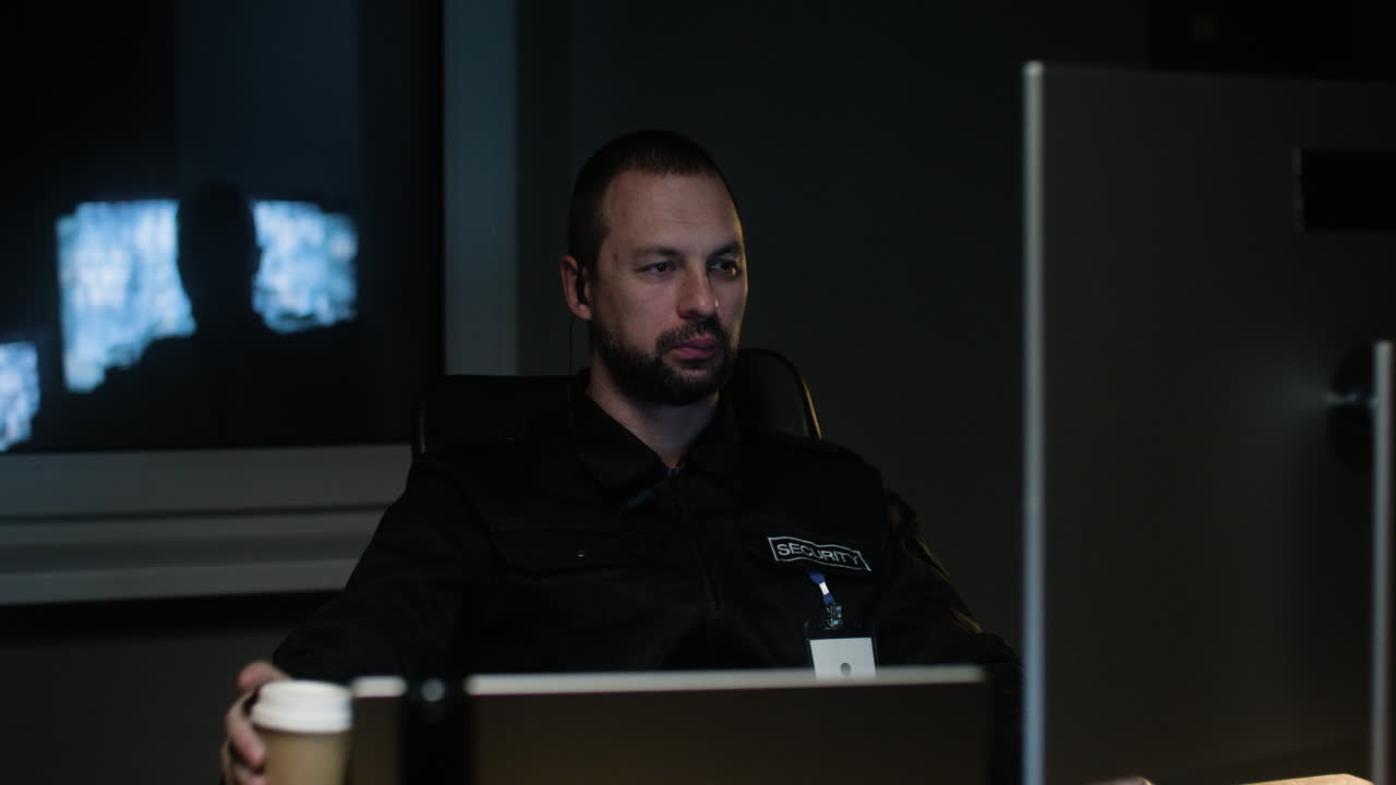 Man with walkie talkie in the hut at night