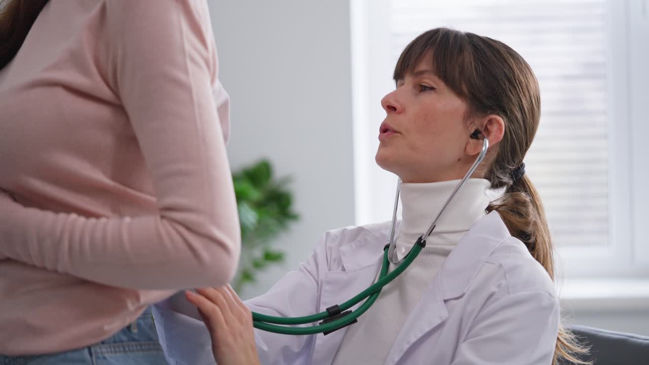 Doctor Examining Patient with Stethoscope