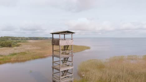 Aerial-circling-around-Vortsjarv-Estonian-lake,-northern-Europe,-cloudy-day