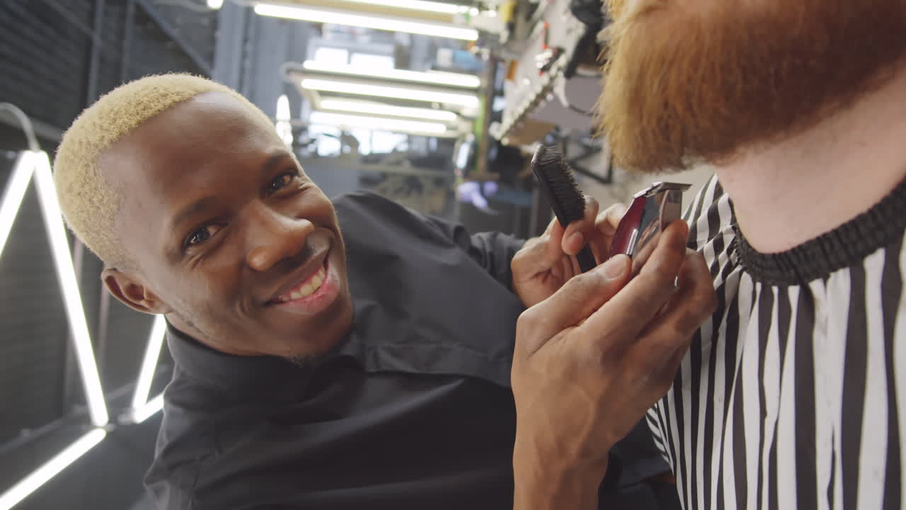 Portrait of Positive Black Barber at Work