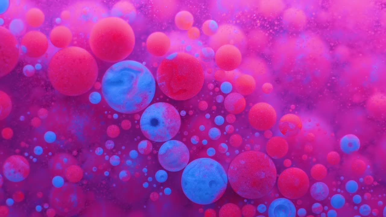 Slow Motion Bright Neon Color Bubbles Oil Beautiful Fluorescent Paint Sparkling Color Moving Multicolor Close up. Acrylic Neon Paint. Fantastic Surface. Abstract Colorful Transformation Gravitation.